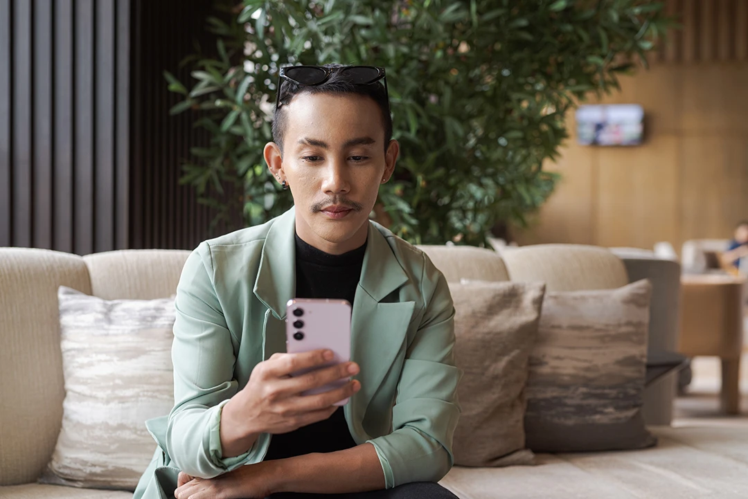 Young person reading on phone
