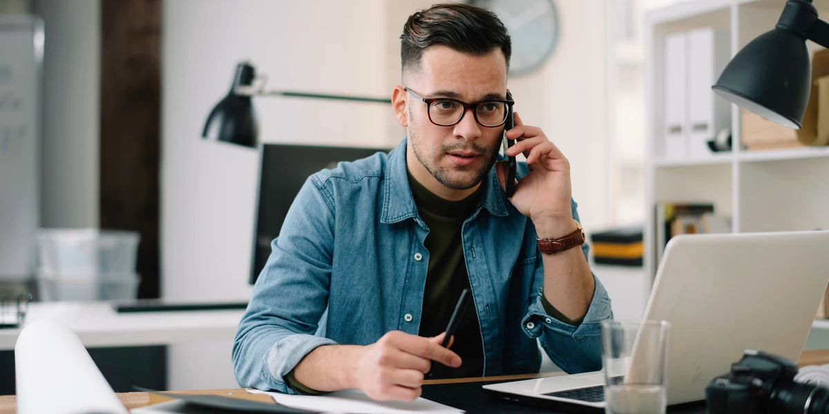 Man on phone asking questions