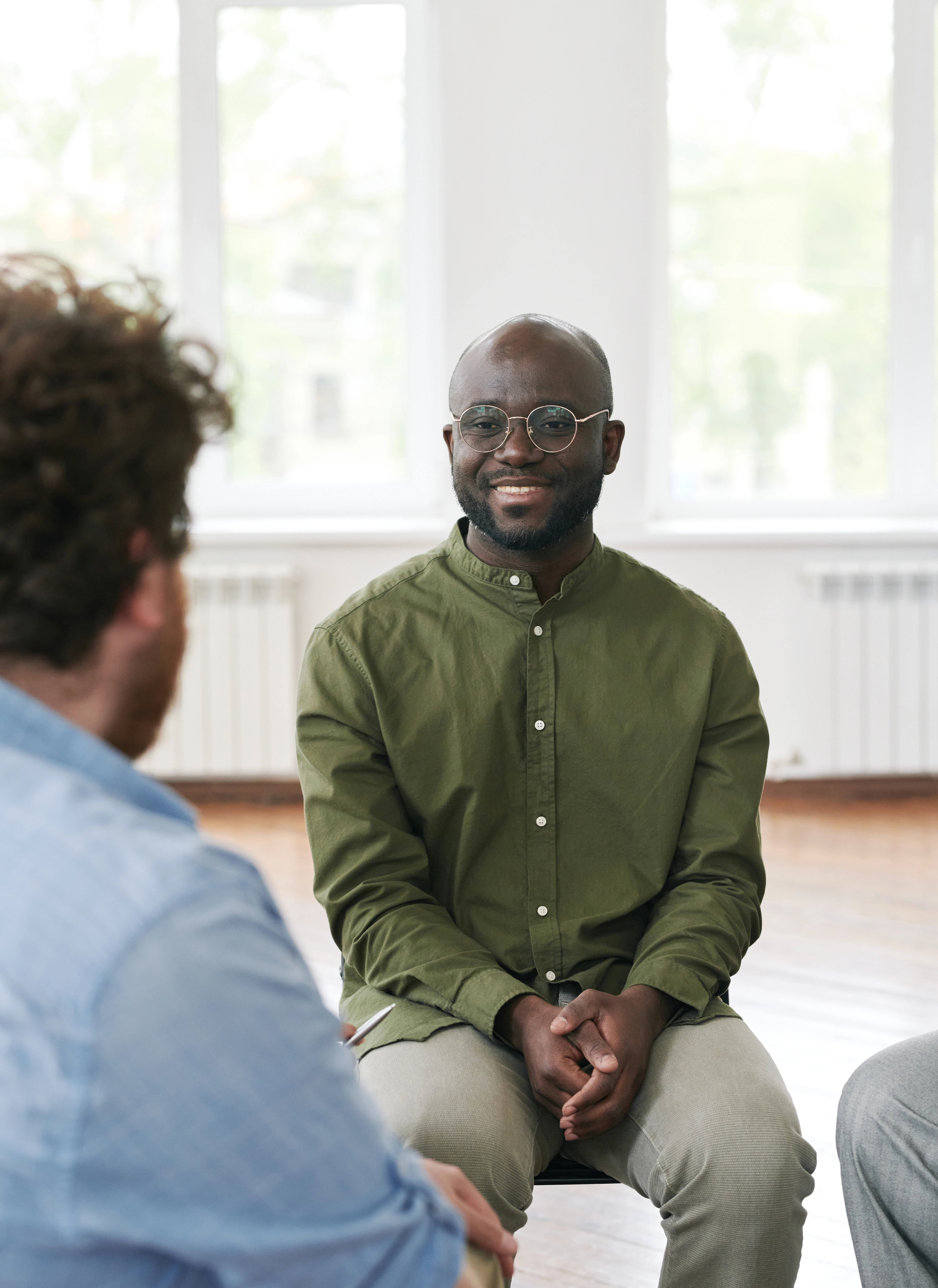man sitting and smiling