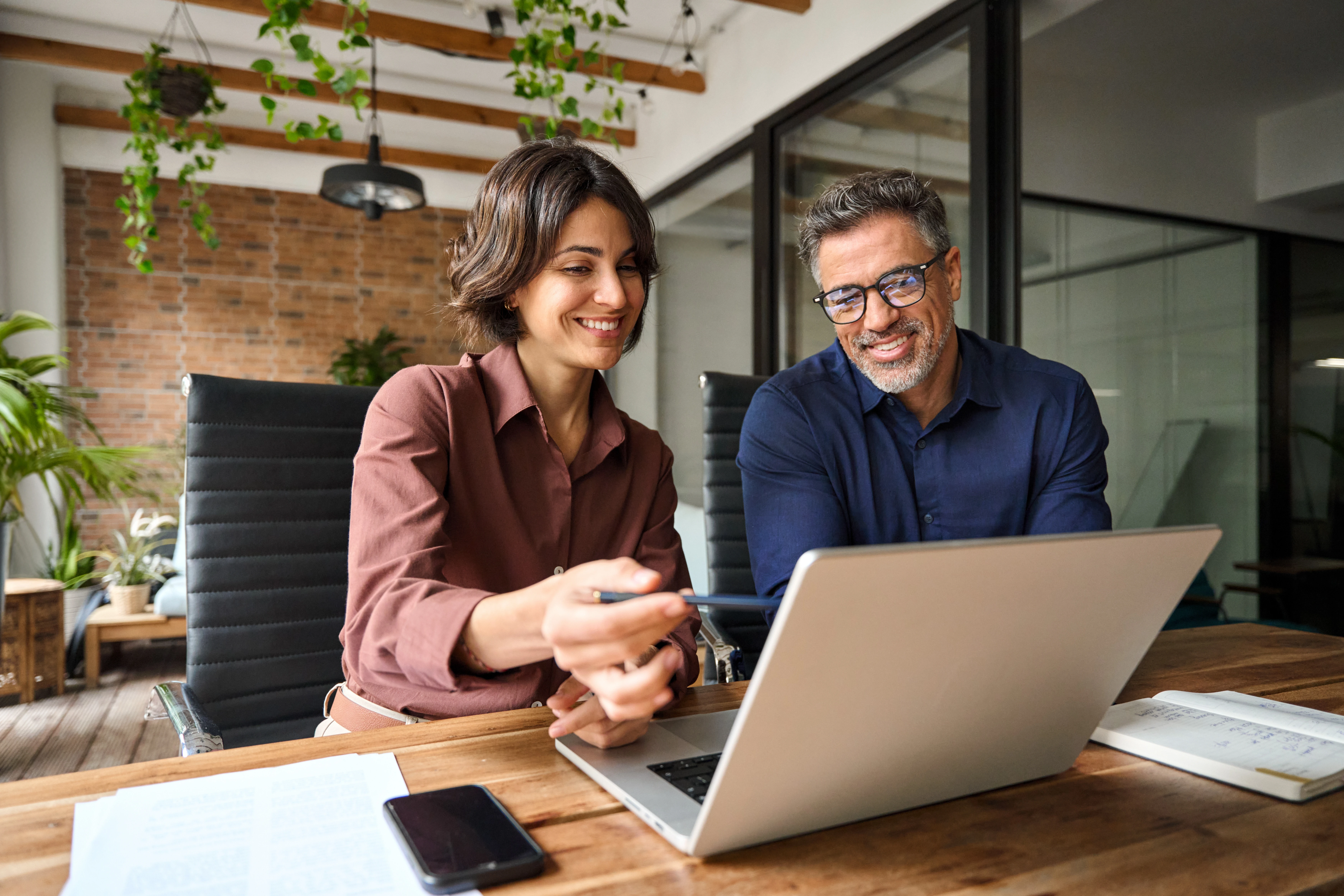 two people looking at computer